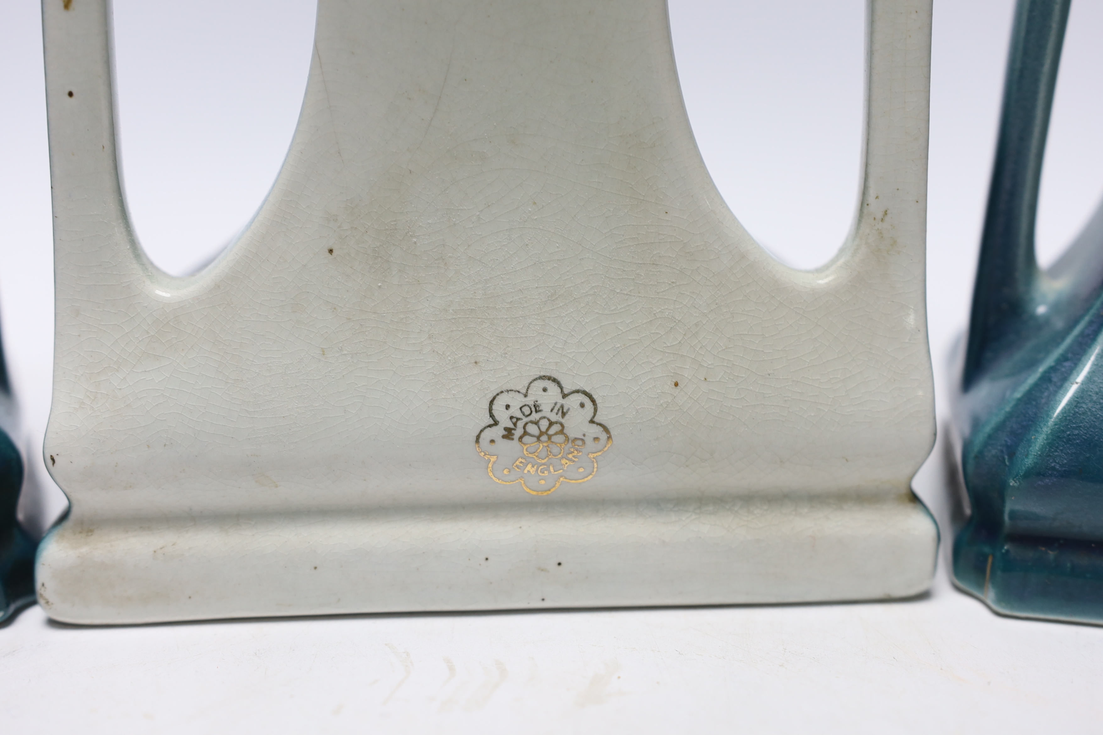 An Art Nouveau clock garniture, decorated with swans in a landscape, stamped ‘Made in England’ to the reverse, clock 23.5cm